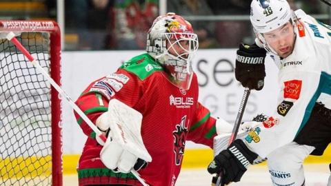 Cardiff Devils' netminder Tyler Wall and Greg Printz of Belfast Giants