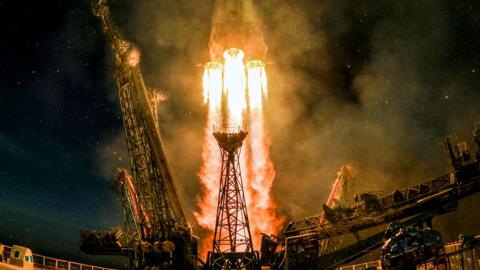 A Soyuz MS-11 rocket carrying Russian, American and Canadian astronauts takes off from the Baikonur Cosmodrome on 3 December 2018