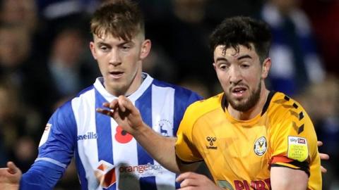 Newport County's Finn Azaz battles with Hartlepool United's Matty Daly