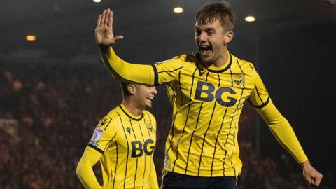 Oxford United's Stanley Mills celebrates his goal against Lincoln City.