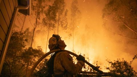 Fire-fighters are struggling to contain huge blazes in California