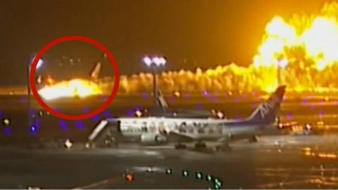 Plane engulfed in flames on airport runway in Tokyo