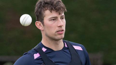 Josh de Caires throws a ball on the field during a game for Middlesex this season