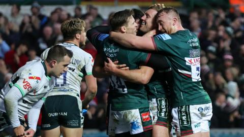 Leicester Tigers player celebrate a try against London Irish