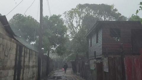 A man walks in heavy rains as Hurricane Iota nears Nicaragua