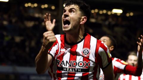 John Egan celebrates