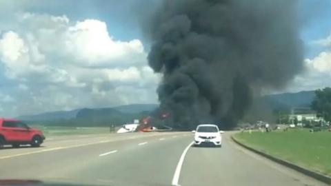 A picture of a plane crash involving a NASCAR driver in Tennessee