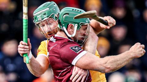 Antrim's Niall McKenna tries to contain Galway's Fintan Burke