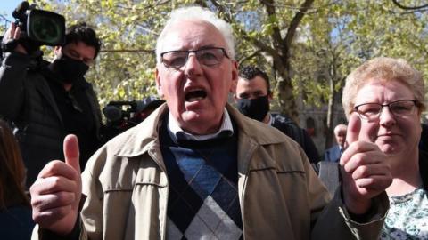 Former post office worker Noel Thomas, who was convicted of false accounting in 2006, celebrates with his daughter Sian outside the Royal Courts of Justice, London, after having his conviction overturned by the Court of Appeal.