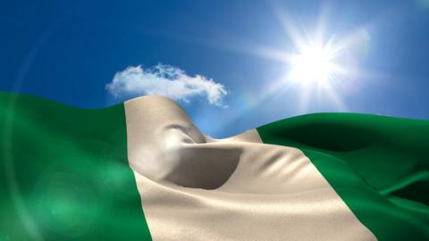 The sun with a Nigerian flag below