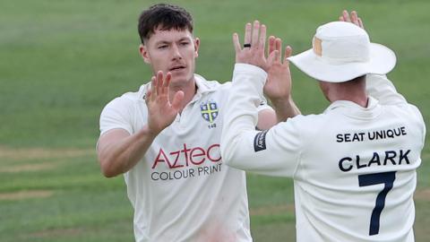 Matthew Potts celebrates taking wicket