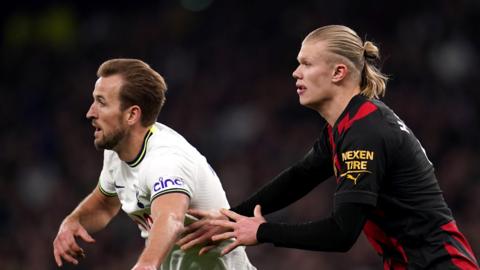 Harry Kane and Erling Halaand tussling during a match