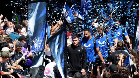  Ben Spencer, the Bath captain, leads his team through a tunnel formed by Bath supporters as they arrive at the Recreation Ground prior to the Gallagher PREM semi final match between Bath Rugby and Exeter Chiefs