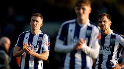 West Brom players on the pitch at the Kassam Stadium following their defeat to Oxford