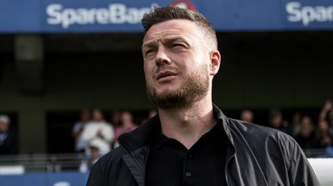Kim Hellberg looks on during his time in charge of Hammarby
