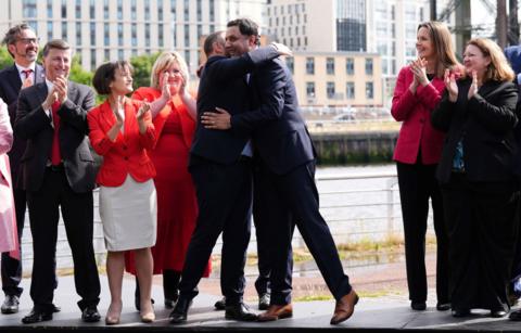 Anas Sarwar hugs Labour MP