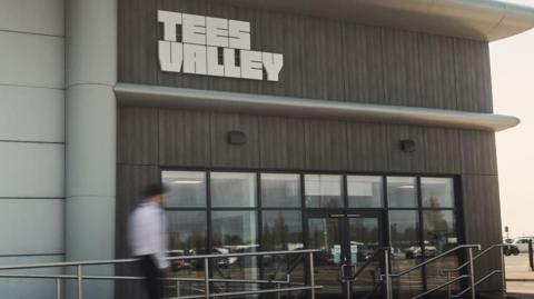 The headquarters of the Tees Valley Combined Authority, which is based at Teesside Airport. The entrance has wooden panels and a glass fronted entrance.