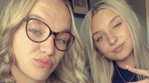 Two sisters posing for a selfie