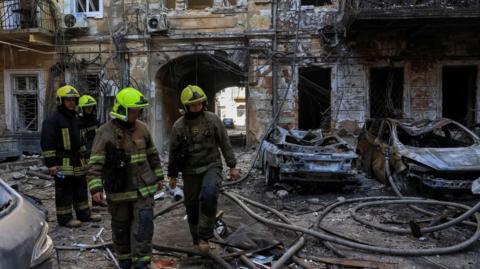 Emergency workers at the scene of an attack in Odesa on 9 August