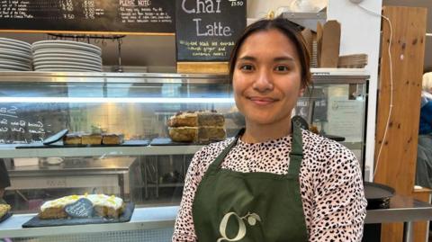 Staff member Aliya M'daris at the Galleries Community Shop and Café in Freshford.