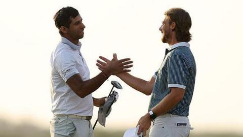 Aaron Rai shaking hands with Tommy Fleetwood after his winning putt.