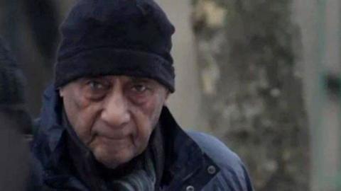 Malcolm Phillips wears a dark hat and looks straight at the camera.