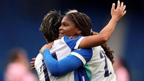 Madison Haley of Brighton & Hove Albion celebrates scoring her team's first goal with teammate Kiko Seike