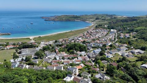 Drone shot of Newtown in Alderney with the sea in the background.