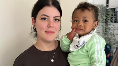 Lindsey and her baby son, Lindsey is wearing a black top whilst the baby is in green