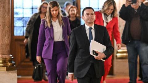 Portuguese Prime Minister Luis Montenegro wearing a suit arrives for a vote of confidence parliamentary debate at the Portuguese parliament in Lisbon