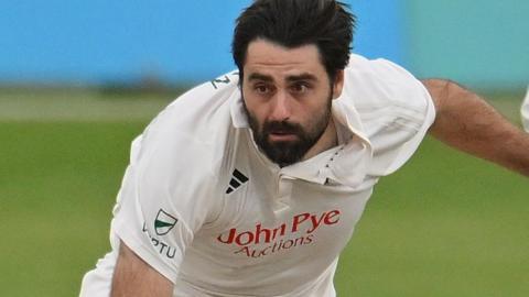 Brett Hutton bowling