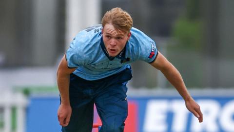Rory Haydon in his follow-through while bowling for Derbyshire