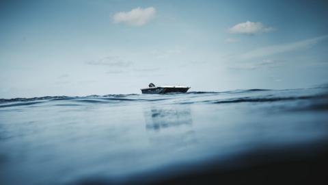 a single fishing boat on the sea