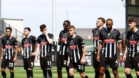 Notts County players lined up at Meadow Lane before a game