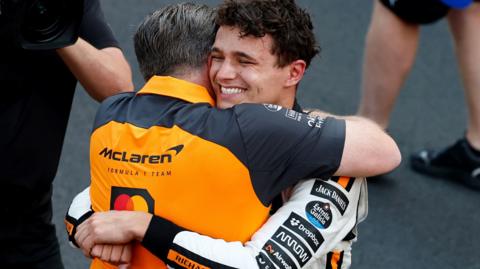 Lando Norris hugs McLaren CEO Zak Brown after winning the Monaco Grand Prix