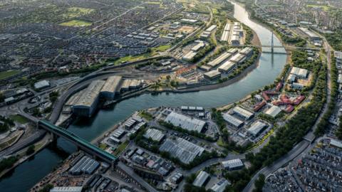 An aerial view of how the new film studios could look. The image shows the River Wear curving through the landscape, while new studio buildings sit along its banks.