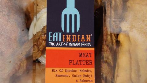 A close-up of the kebab meat platter packet. The label says it contains samosas, onion bhaji and pakoras. 