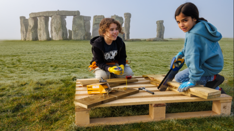 Children with building materials