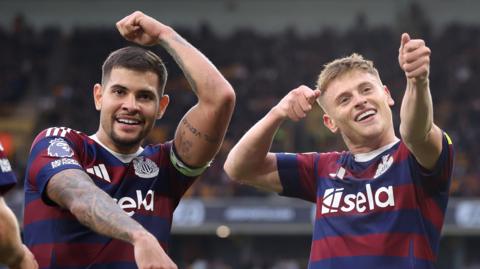 Harvey Barnes and Bruno Guimaraes celebrate Barnes' winner at Wolves