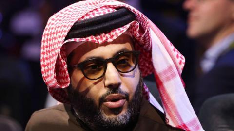 Turki Alalshikh looks on from ringside before a boxing fight in Riyadh, Saudi Arabia.