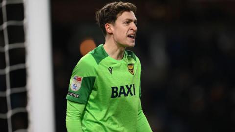 Oxford goalkeeper Jamie Cumming in action