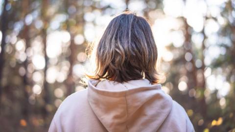 young woman in a forest