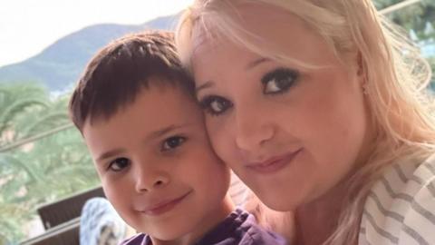 A close up picture of Hollie, who has got blonder hair, and Jacob. They are both smiling.