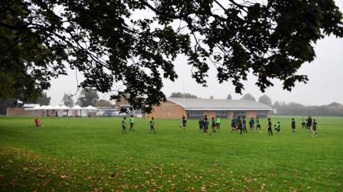 Students playing in a school field