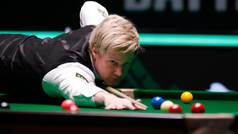 Neil Robertson plays a shot
