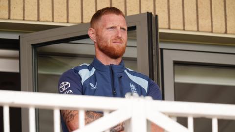 England captain Ben Stokes looks on from the balcony while his side lose to New Zealand