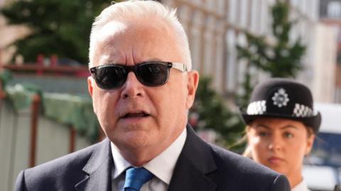 Former 鶹Լ news presenter Huw Edwards walks outside Westminster Magistrates' Court, ahead of his court hearing after being charged with indecent child picture crimes, in London, Britain, July 31, 2024