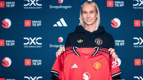 Ellen Wangerheim holds a Manchester United shirt