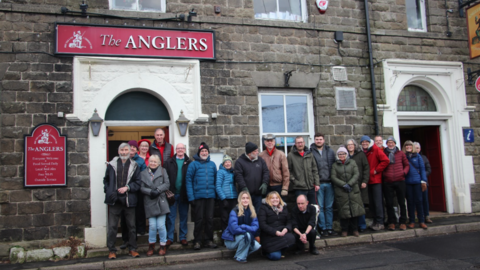 Staff and volunteers outside the Anglers Rest in Bamford that is struggling financially