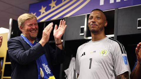 King Willem-Alexander of the Netherlands and Curacao goalkeeper Eloy Room